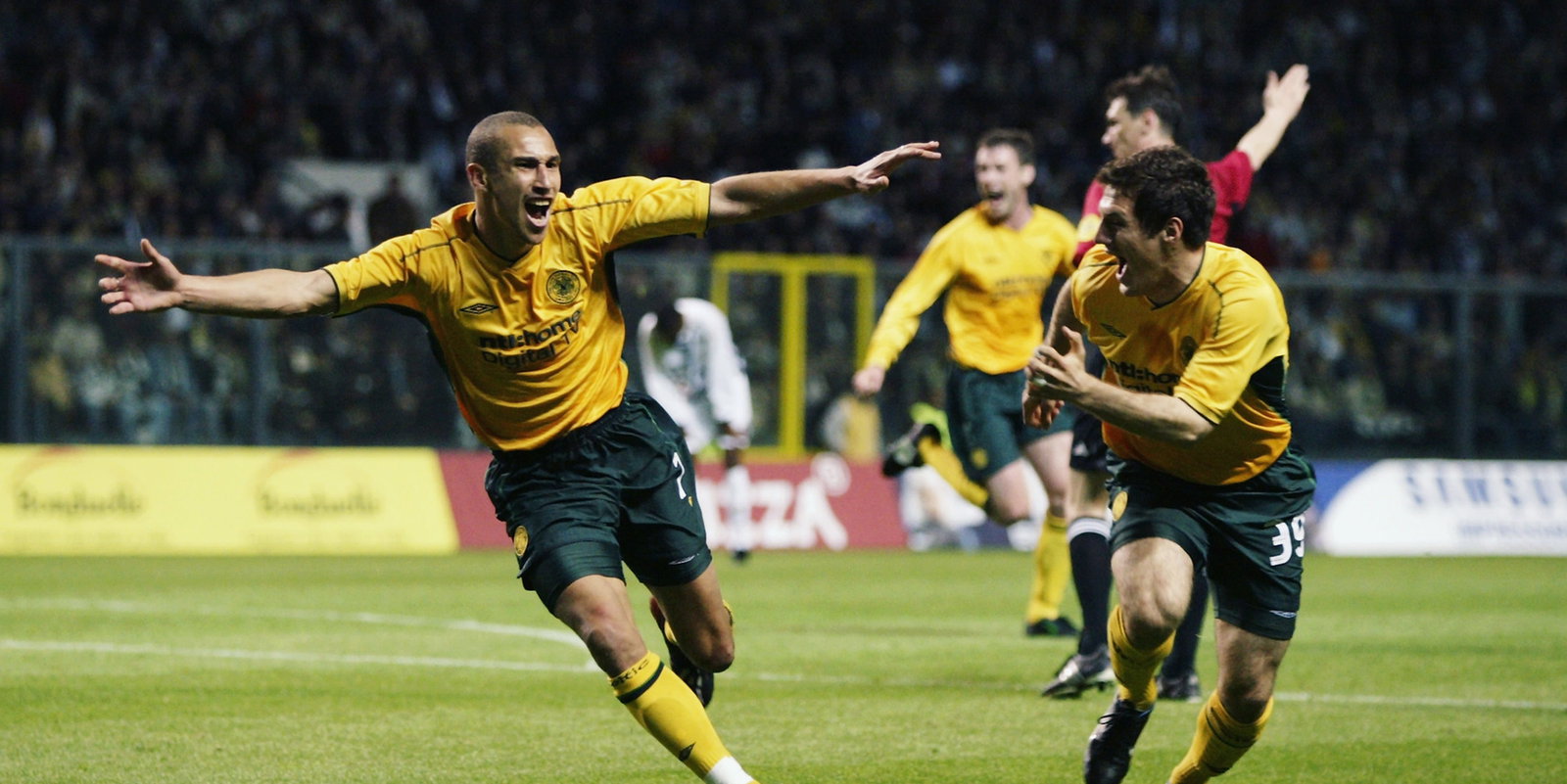 Henrik Larsson of Celtic celebrates scoring with Chris Sutton of Celtic
