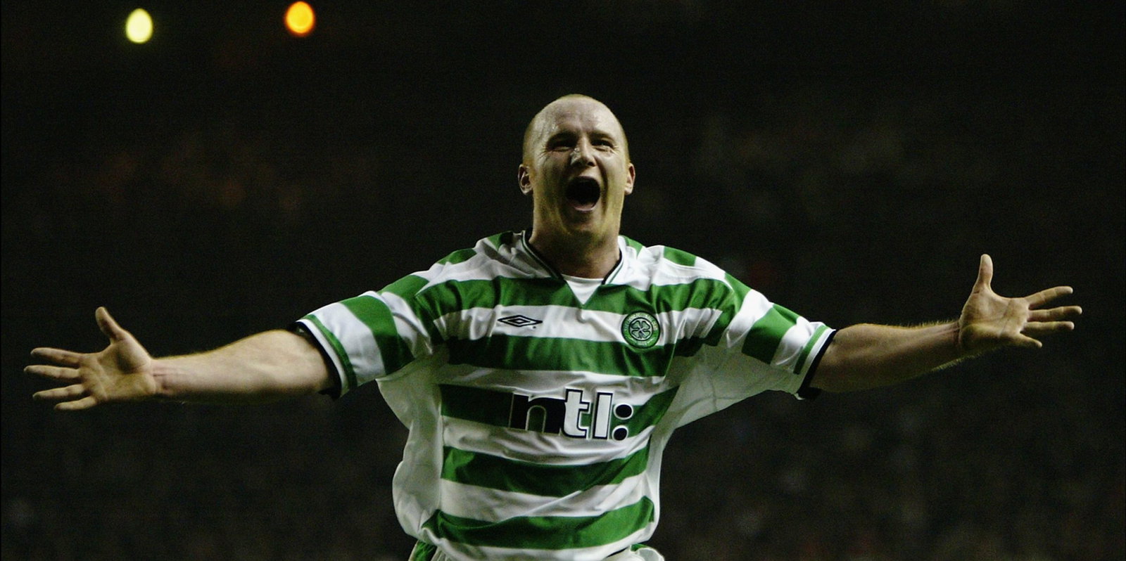John Hartson of Celtic celebrates scoring the second goal of the match to put his team through to the next round