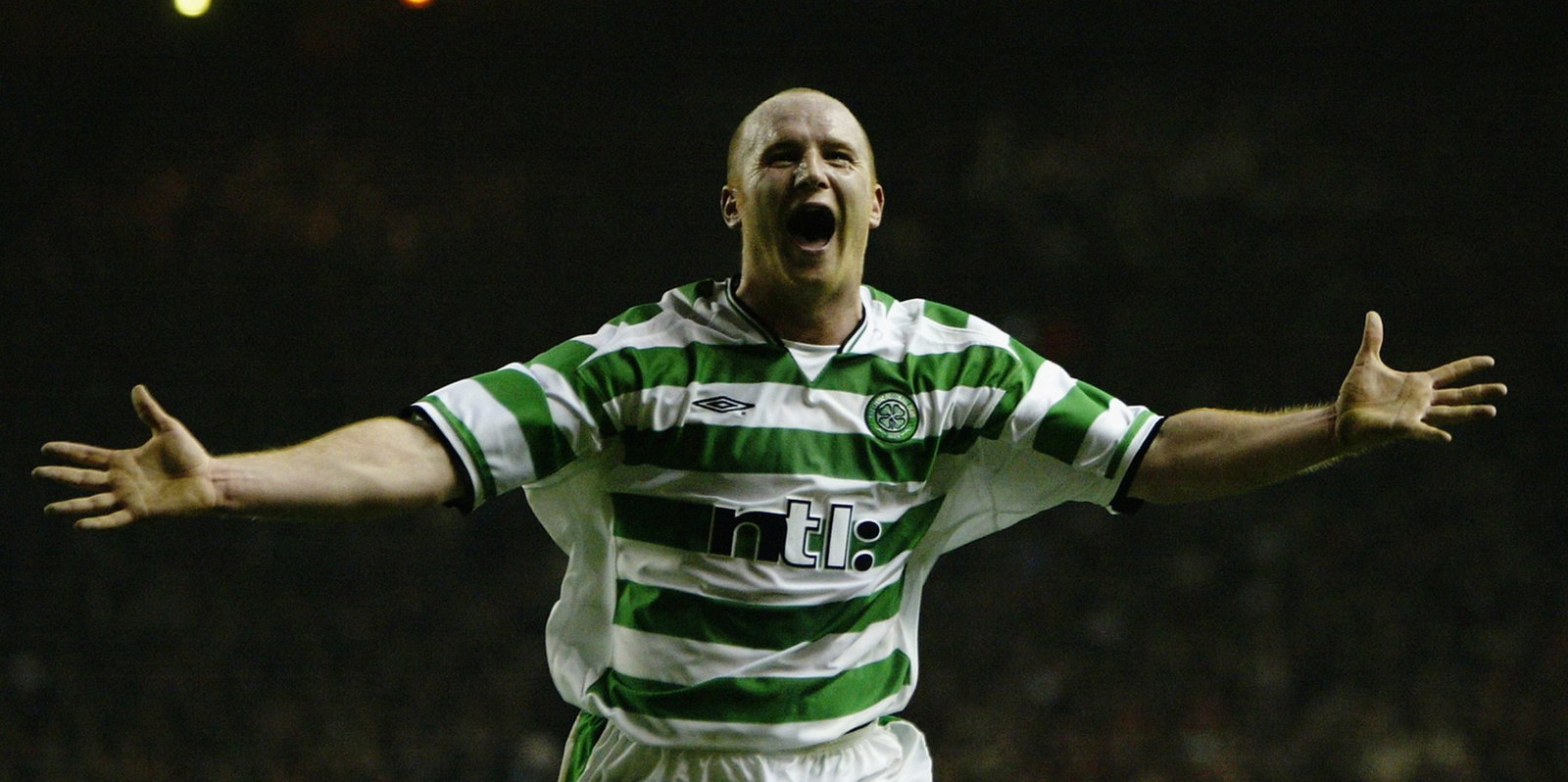 John Hartson of Celtic celebrates scoring the second goal of the match to put his team through to the next round