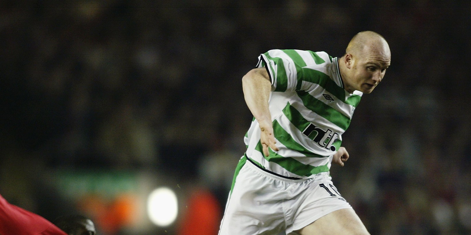 John Hartson of Celtic and Djimi Traore of Liverpool