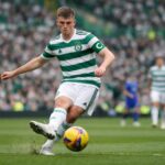 Dane Murray with celtic captains arm band on passingthe ball in celtic park