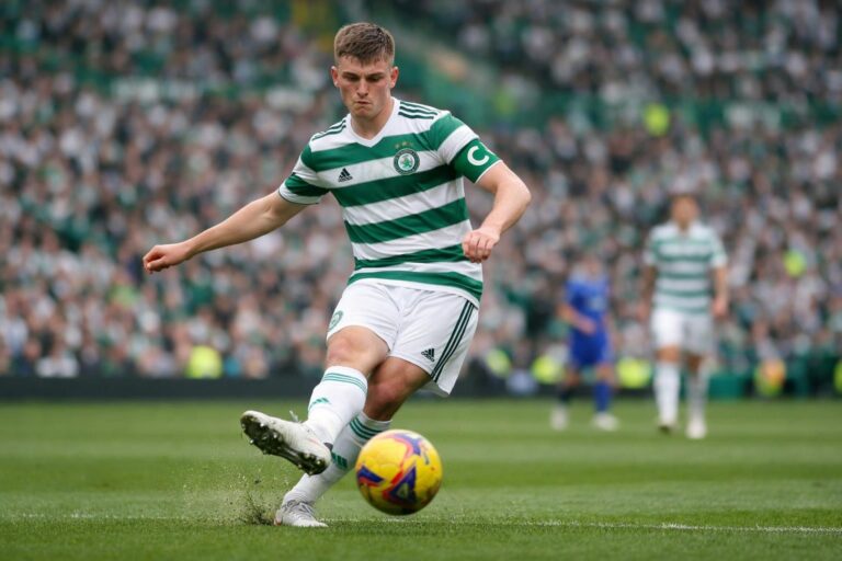 Dane Murray with celtic captains arm band on passingthe ball in celtic park