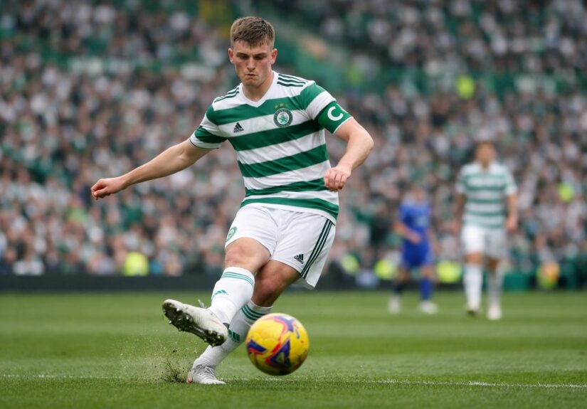 Dane Murray with celtic captains arm band on passingthe ball in celtic park