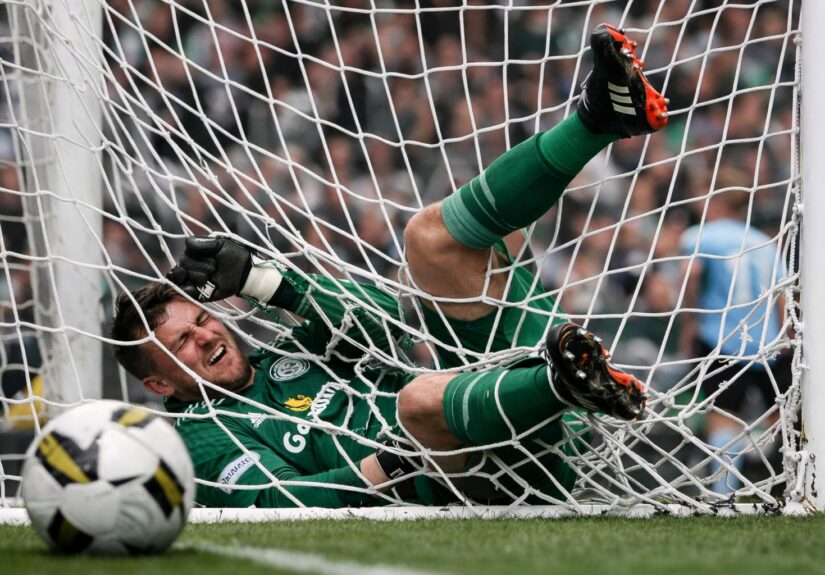 Celtic goalkeeper falling in the back of the net