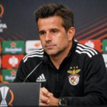Benfica boss Marco Silva at a press conference with a Europa League background