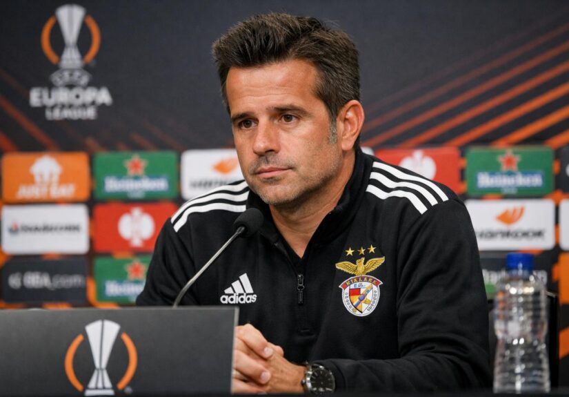 Benfica boss Marco Silva at a press conference with a Europa League background