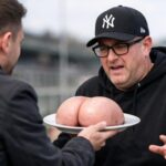 DJ Ewen Cameron with his baseball cap and glasses on