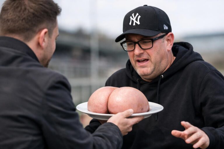 DJ Ewen Cameron with his baseball cap and glasses on