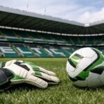 Me a picture of a ball, goalkeepers gloves and Celtic Park in the background